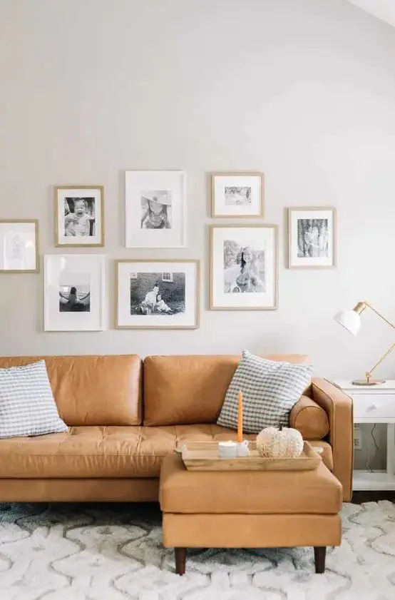 A cozy Scandinavian living room with a tan leather sectional